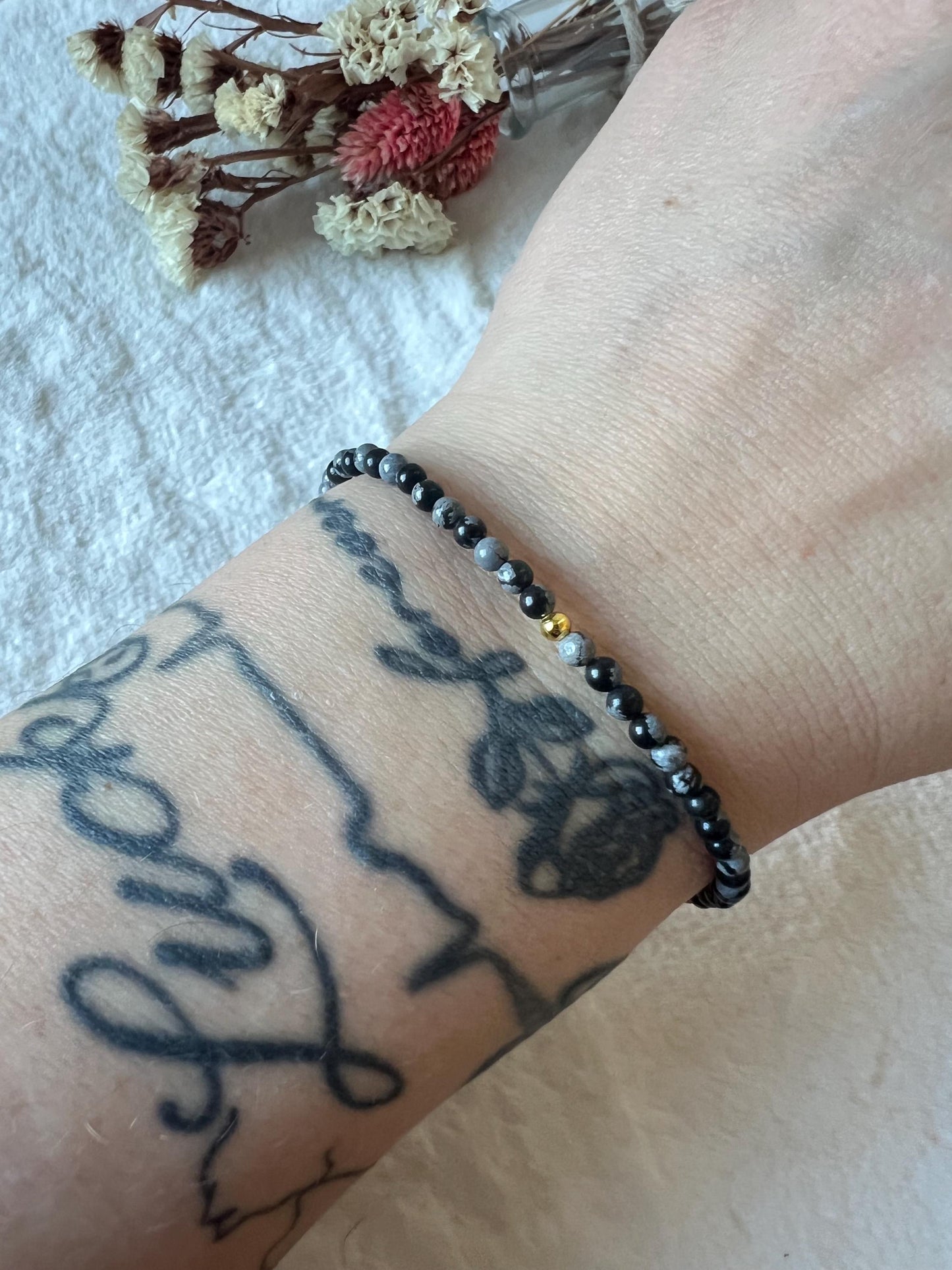 Schneeflocken Obsidian Armband goldfarben grössenverstellbar
