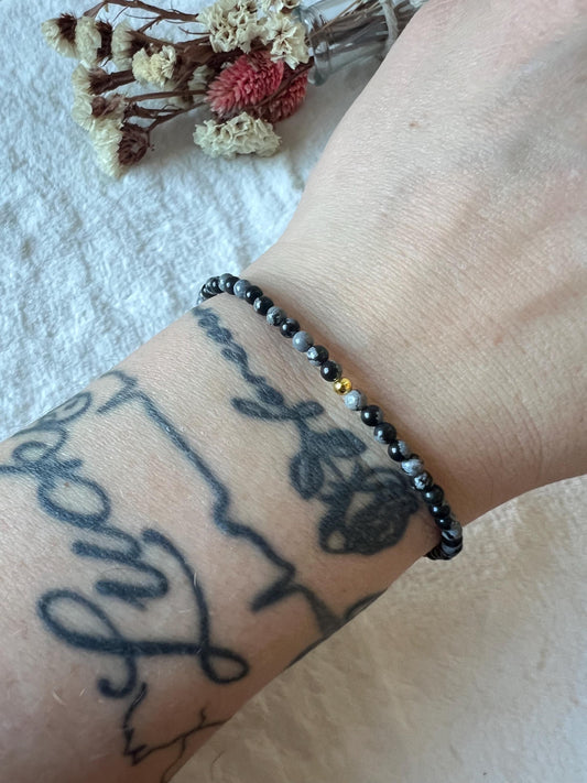 Schneeflocken Obsidian Armband goldfarben grössenverstellbar